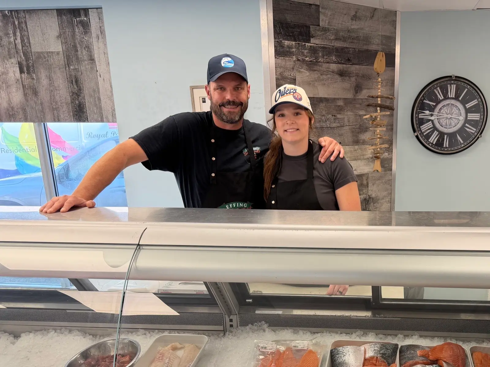 The father-and-daughter team behind the counter at our Edmonton retail shop